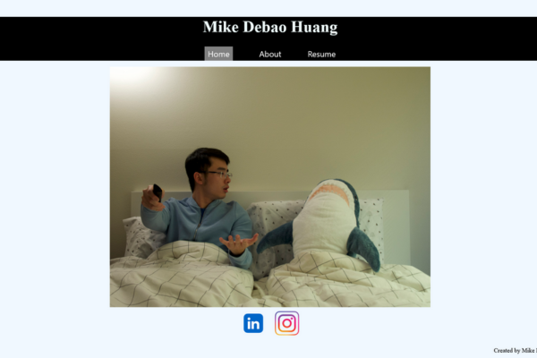 Website homepage featuring a man in a bed with a stuffed shark next to him